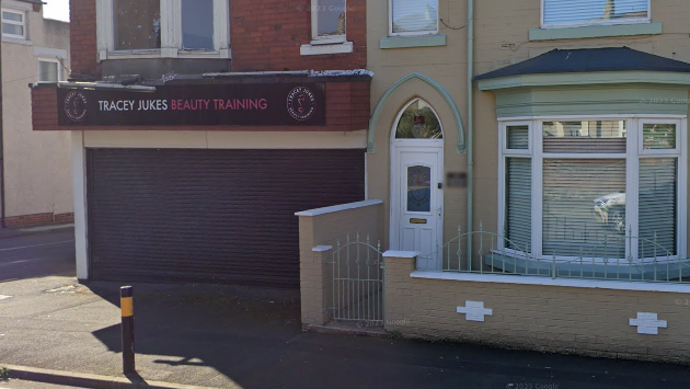 Disused beauty salon frontage, on a terraced street