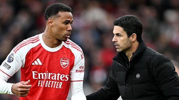 Arsenal manager Mikel Arteta talks to defender Gabriel