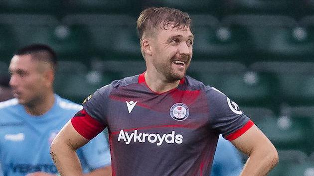 Nathan Peate looks on during a Bala game