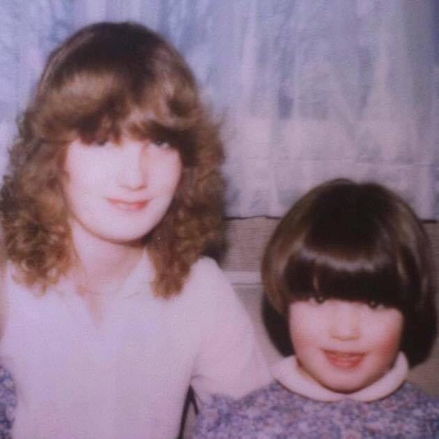 Sophie Leggett as a young child with short hair and a fringe next to her mother, a woman with curly light-brown hair.