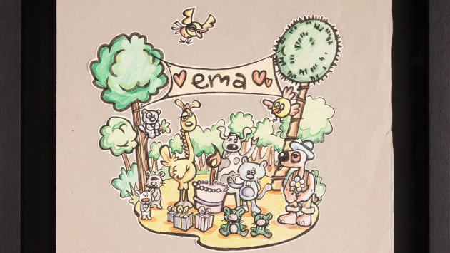 An image of cartoon animals in woodland with a birthday cake and a banner saying 'Ema'