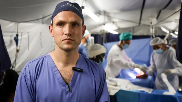 Matthew Newport in blue surgical scrubs