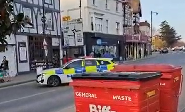 screengrab from video showing police car in the road