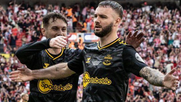 Southampton's Adam Armstrong (right) celebrates scoring his side's first goal with team mate David Brooks