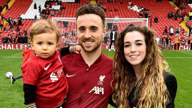 Diogo Jota with his partner Rute Cardoso, who he later married, and their eldest child at Anfield after Liverpool's final Premier League game of the 2021-22 season