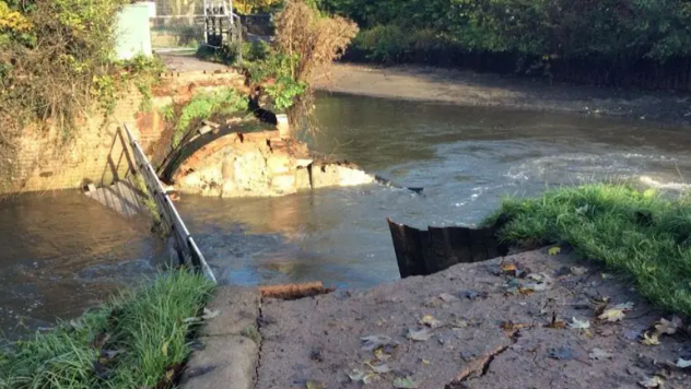 The Tumbling Bay Weir bridge which runs over the River Wey in Guildford, pictured after collapsing in 2019 following heavy rain.