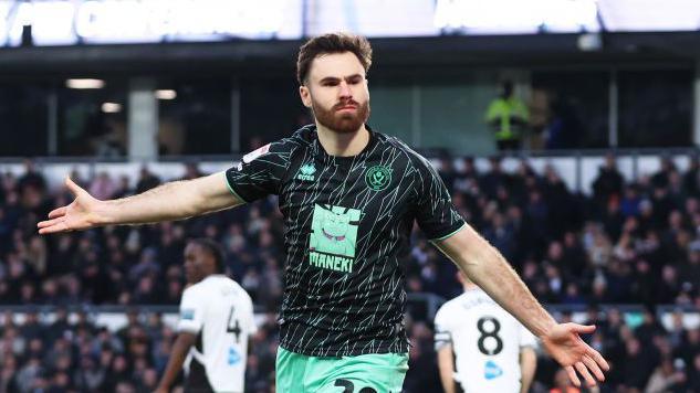 Ben Brereton Diaz celebrates with his arms out wide after scoring for Sheffield United