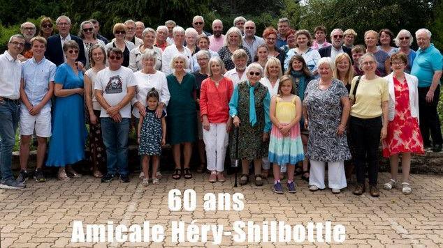 A big group of people with a caption saying 60 years of friendship 