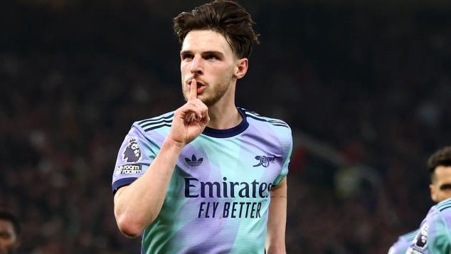 Declan Rice gestures towards the Stretford End after putting Arsenal level against Manchester United at Old Trafford