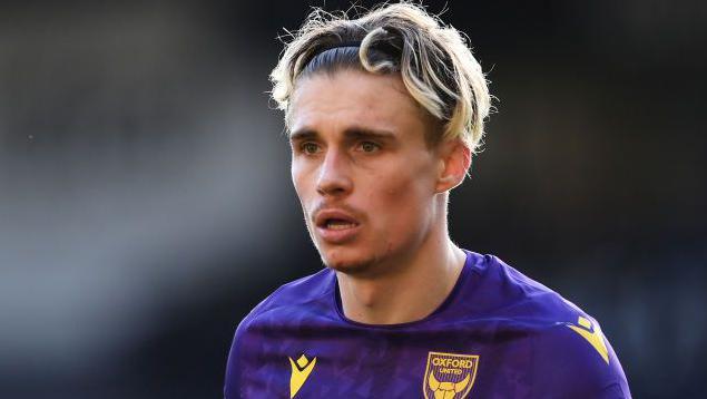 Oxford United winger Przemyslaw Placheta in action for the club, wearing their purple kit