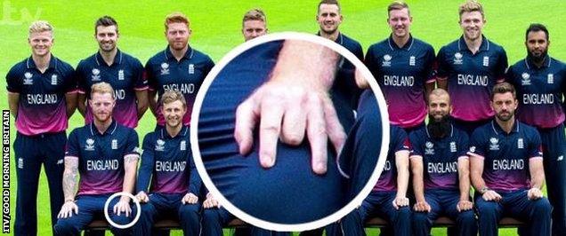 England squad photo with Ben Stokes pulling the middle finger of his left hand back