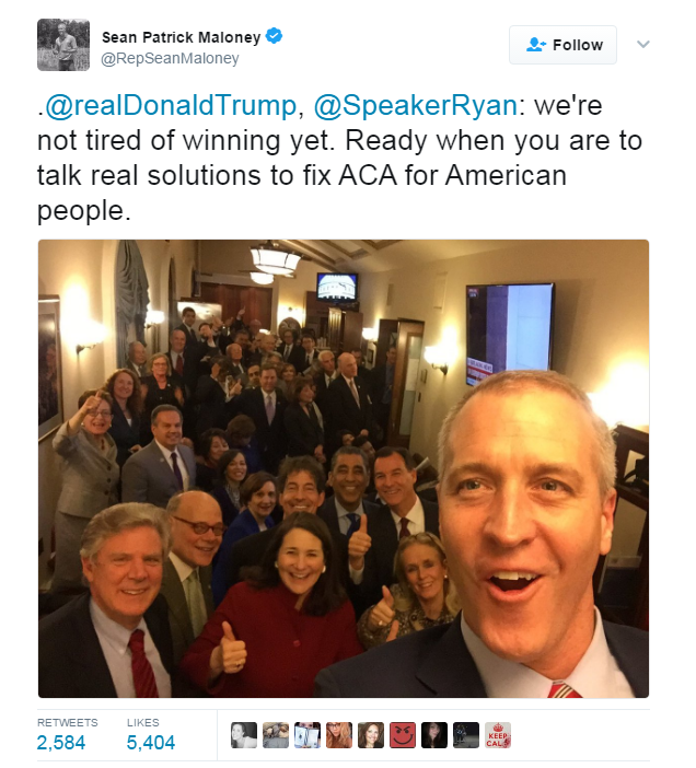 Sean Maloney tweets a picture of happy democrats, with the words: ".@realDonaldTrump, @SpeakerRyan: we're not tired of winning yet. Ready when you are to talk real solutions to fix ACA for American people.