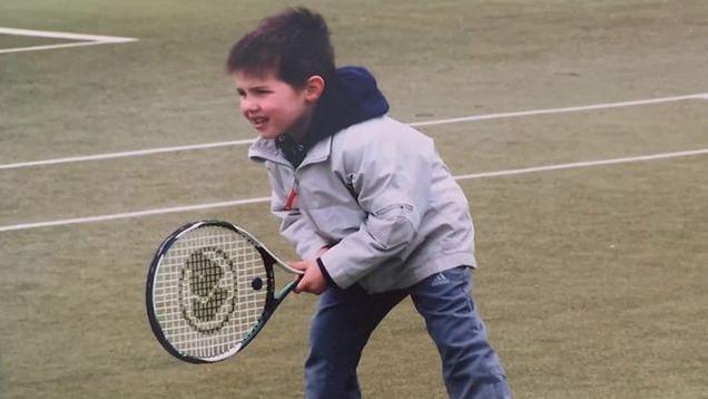 Arthur Fery with a racquet when he was a child