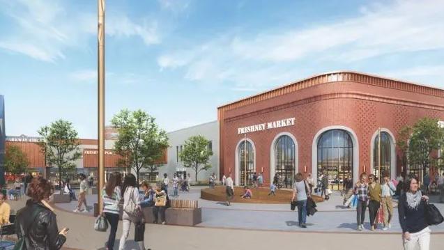 A computer-generated image of how Freshney Place will look, including a smart public space, with pavement cafe tables outside a shop front, and a market hall in a red-brick building with large windows. 