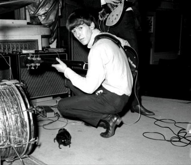 George Harrison from the Beatles pictured with a guitar in the 1960s