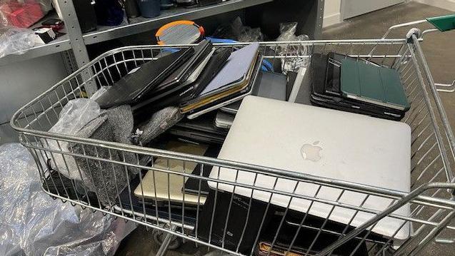 A trolley full of personal computers