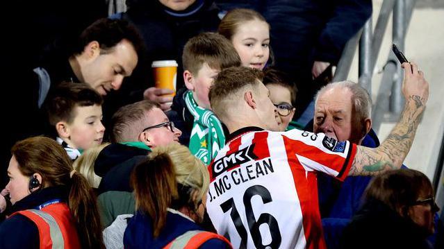 James McClean spent time after the game posing for pictures with opposition supporters