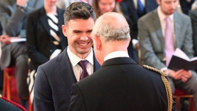 James Anderson is presented with his medal by Prince Charles at Buckingham Palace