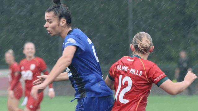 Gwalia United and Bournemouth players in action