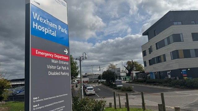 A 15 foot tall sign at the main entrance to Wexham Park Hospital shows people where they should go and where they should park when coming to an appointment