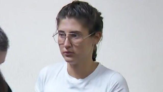 Bella Culley filmed in court. She is wearing glasses and has brown hair in a plait and is wearing a white top