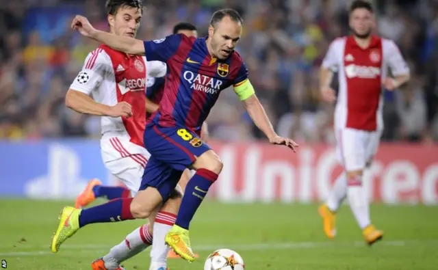 Andres Iniesta runs with the ball