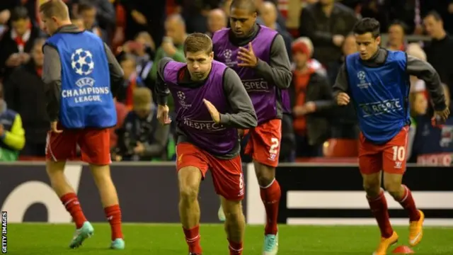 Liverpool players warm up