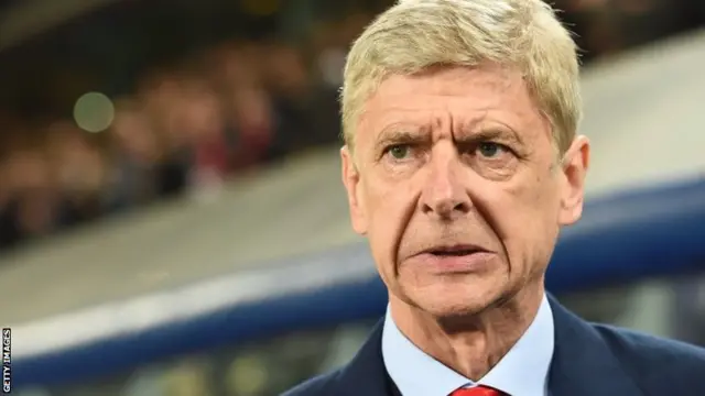 Arsene Wenger looks on
