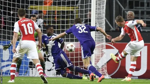 Lukas Podolski scores the winning goal