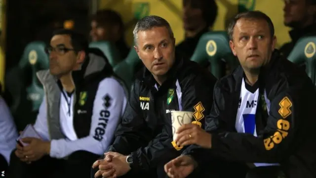 Neil Adams looks on