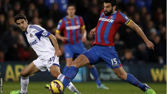 Jordi Gomez challenges Crystal Palace's Australian midfielder Mile Jedinak