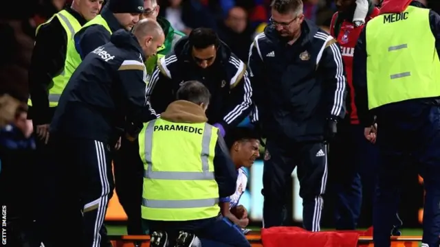 Patrick van Aanholt receives treatment on his shoulder