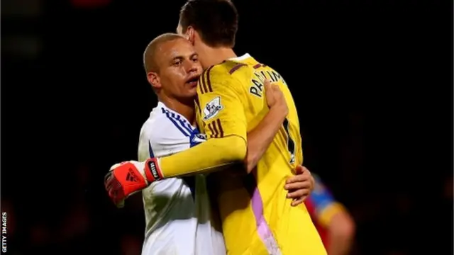 Wes Brown and teammate Costel Pantilimon embrace at full time