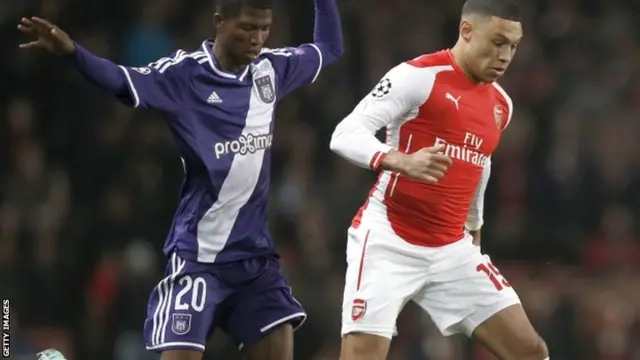 Alex Oxlade-Chamberlain is challenged by Guinea Ibrahima