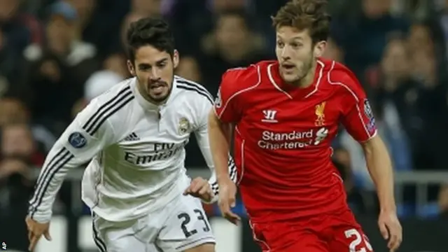 Adam Lallana advances with the ball