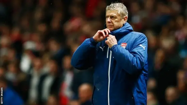 Arsene Wenger looks on