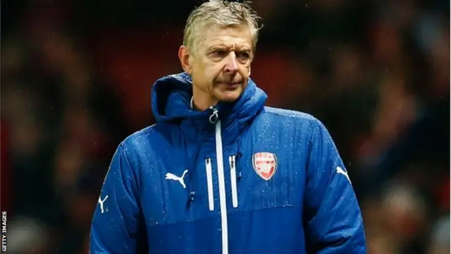 Arsene Wenger looks on dejected