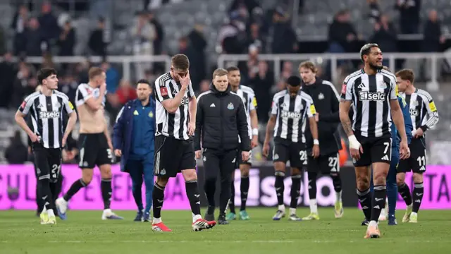 Newcastle players and Eddie Howe look dejected after full-time