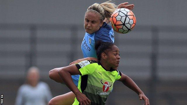 Steph Houghton of Manchester City Women leaps highest against Jade Boho Sayo of Reading FC Women