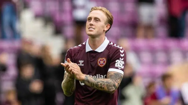 Calvin Miller claps Hearts fans