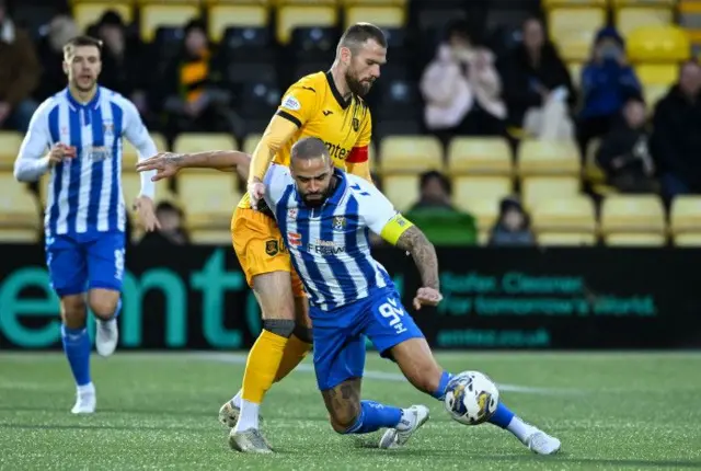 Kyle Vassell tussling for the ball