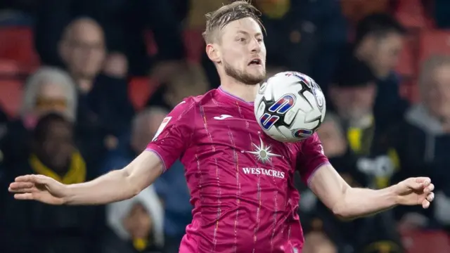 Harry Darling in action at Watford earlier this season