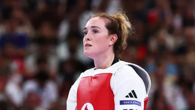 Rebecca McGowan of Team Great Britain reacts after losing the Women's +67kg Quarterfinal match against Svetlana Osipova of Team Uzbekistan (not pictured) on day fifteen of the Olympic Games Paris 2024 at Grand Palais 