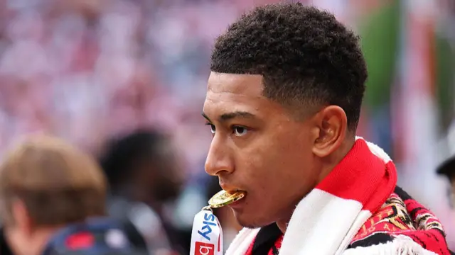 Jobe Bellingham bites his Championship play-off winners medal