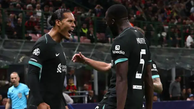 Virgil van Dijk and Ibrahima Konate celebrate for Liverpool at AC Milan