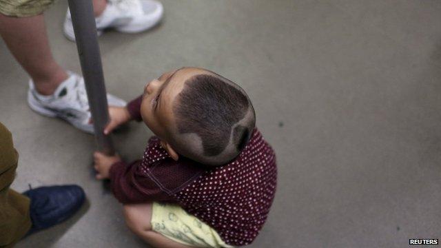 Boy with Apple logo haircut