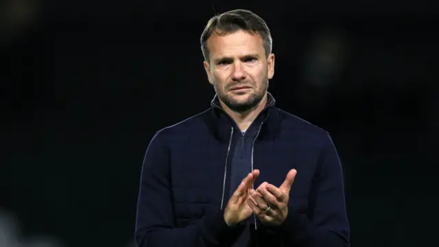 Tom Cleverley claps his hands after a match