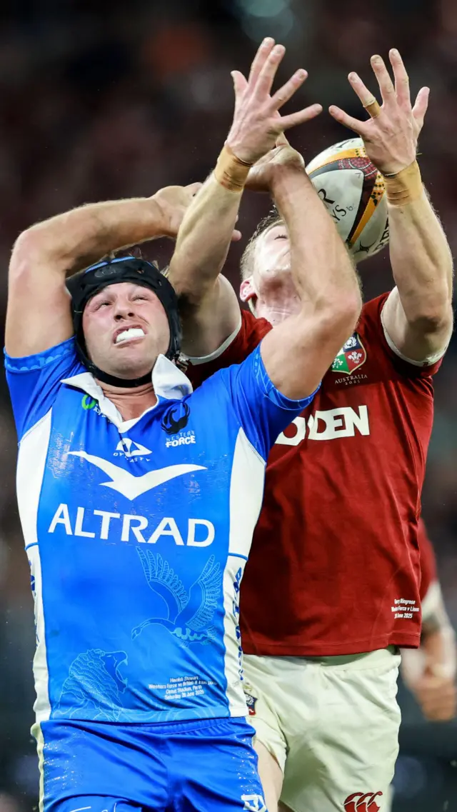 Hamish Stewart competes for the ball in the air with Garry Ringrose of the British and Irish Lions 