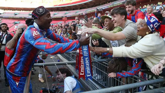 Mateta lets fans touch the FA Cup at Wembley