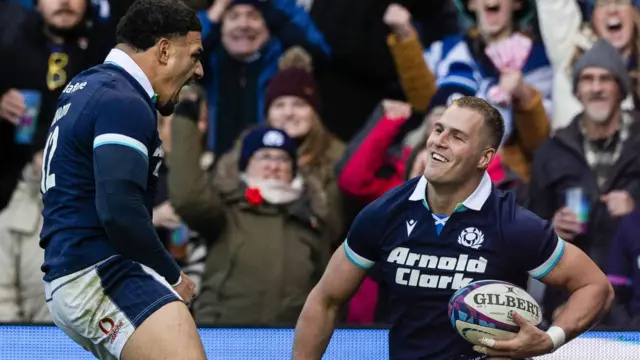 Scotland's Duhan van der Merwe (R) celebrates scoring his side's second try with Sione Tuipulotu during The Famous Grouse Nations Series match between Scotland and Australia at the Scottish Gas Murrayfield Stadium on November 24, 2024, in Edinburgh